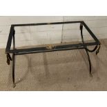 A wrought iron coffee table with swan neck end supports terminating in web feet (H43cm W83cm D42cm0