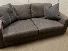 A grey three seater Marks and Spencers sofa (H69cm W197cm D90cm)