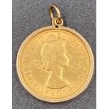 A 1958 Gold Sovereign on a 9ct gold pendant mount (Approximate Total weight 9.4g)