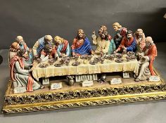 A very large Capodimonte group, the Last Supper by Cortese. 85cm by 40cm by 34cm on gilt plinth AF