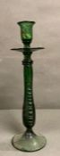 A vintage emerald green hand blown glass candle stick