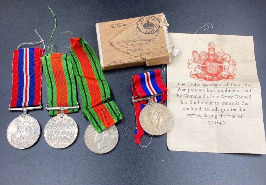 War Medal and Defence Medal, two sets awarded to Mr A W Green