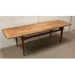 A Danish teak France and Sons coffee table Model FD503 1958 (W150cm D52cm H47cm)