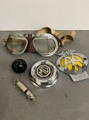 A selection of car memorabilia, including goggles