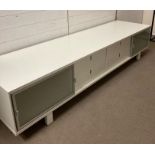 A four drawer, two cupboard Hulsta media unit (H50cm W243cm D64cm)