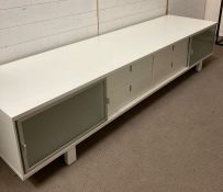 A four drawer, two cupboard Hulsta media unit (H50cm W243cm D64cm)