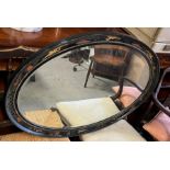 A vintage oval inlaid mirror