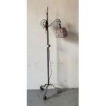 A wrought iron Mid Century floor lamp