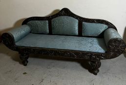 An ebonised Anglo Indian sofa