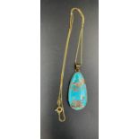 An 18ct gold chain with blue stone pendant (Chain approximate weight 3.4g)