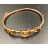 A 9ct gold horse show themed bangle (Approximate Total Weight 5.5g)