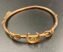 A 9ct gold horse show themed bangle (Approximate Total Weight 5.5g)