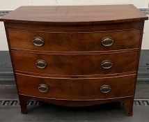 A bow front chest of drawers (H92cm W105cm D53cm)