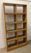 A light oak room divider/bookcase (open back) (W103cm D30cm H195cm)
