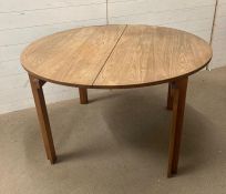 A teak France and Sons dining table with two leaves (Dia 120cm H70cm)