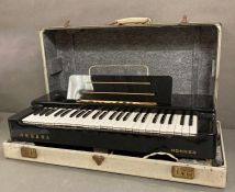 A cased Hohner organa organ