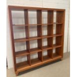 A beech open back wall divider/bookcase (W164cm D36cm H174cm)