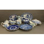 A selection of blue and white and some green and white ceramics to include plates, platters, gravy