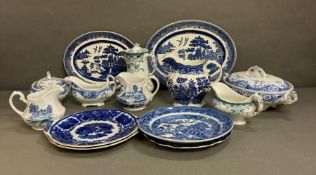 A selection of blue and white and some green and white ceramics to include plates, platters, gravy