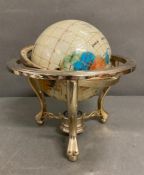 A Nautica world globe with compass set