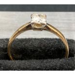 A single diamond ring (4mm diameter approximately) on an 18ct yellow gold setting size M