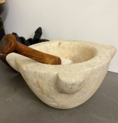 A large antique white mortar and pestle, along with a wooden bowl (31cm dia x 15cm H)