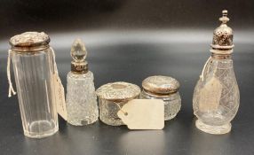 A selection of five silver topped or necked cut glass items