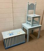 A blue pirate themed child's bedroom set to include table, chair and toy box