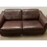 A brown leather lounge suite, comprising of a reclining chair, two seater sofa and three seater sofa
