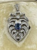A Heart shaped antique diamond heart pendant with central sapphire
