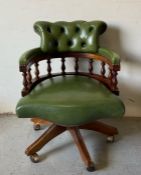 A captains office chair in green
