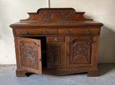 An oak three drawer sideboard with cupboard under
