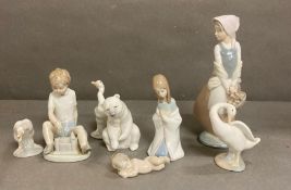 A selection of Nao and Lladro figures and animals