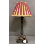 A cast iron Empire style table lamp on lion paws feet