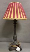 A cast iron Empire style table lamp on lion paws feet