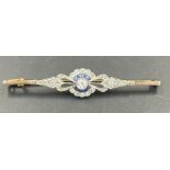 An Antique Diamond brooch, central stone surrounded by six small cut sapphires