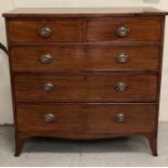 A mahogany two over three chest of drawers with brass drop handles and splayed feet (W110cm D53cm