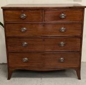 A mahogany two over three chest of drawers with brass drop handles and splayed feet (W110cm D53cm