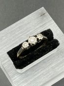 A Three stone diamond ring in 9ct yellow gold and platinum setting Size O