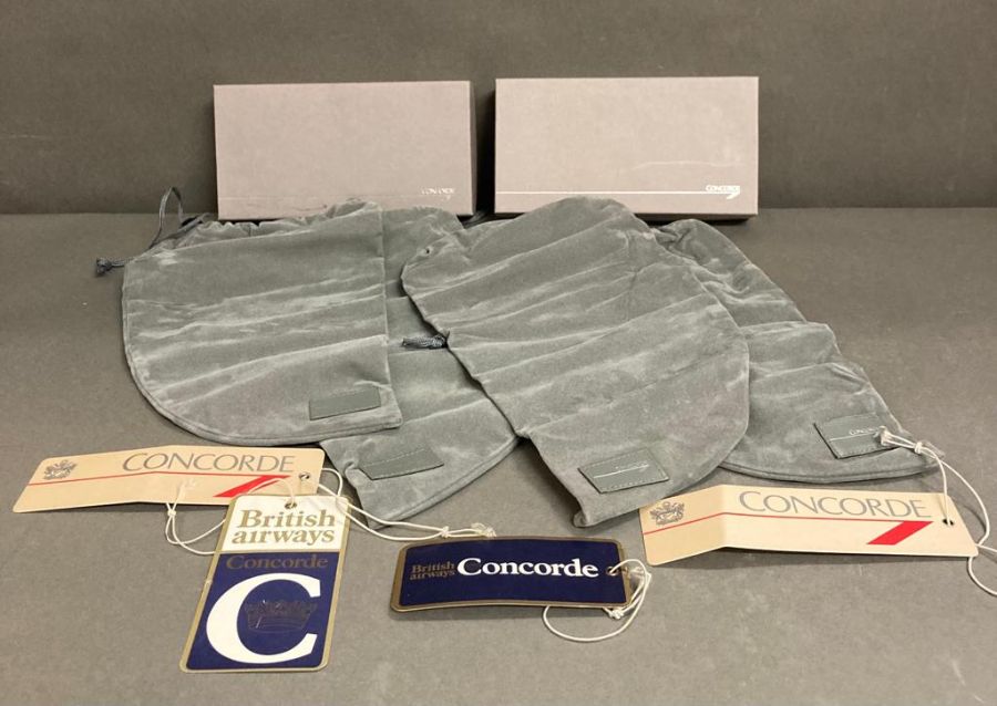 A selection of Concorde collectable to include shoe bags and luggage tags