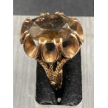 A 9ct gold ring with central smokey quartz style stone (Approximate Total weight 4.7g)