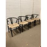 A set of four black painted Lom Bok Mid Century dining chairs