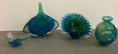 A selection of blue and green decorative glass