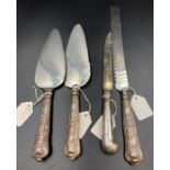 A selection of four silver handled cutlery items, various hallmarks and makers.