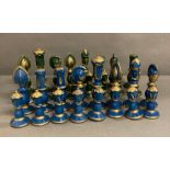 A blue and green wooden painted chess set