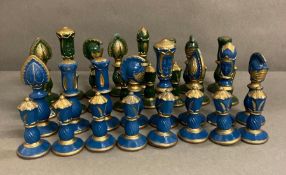 A blue and green wooden painted chess set