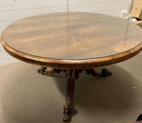A mahogany pedestal tilt top dining table with renaissance revival style feet AF