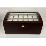 A Large 24 watch collectors box, with two pull out trays, glass top and key.