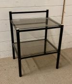 A glass two tiered side table