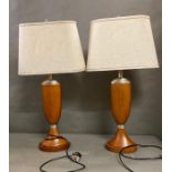 A pair if wooden base table lamps